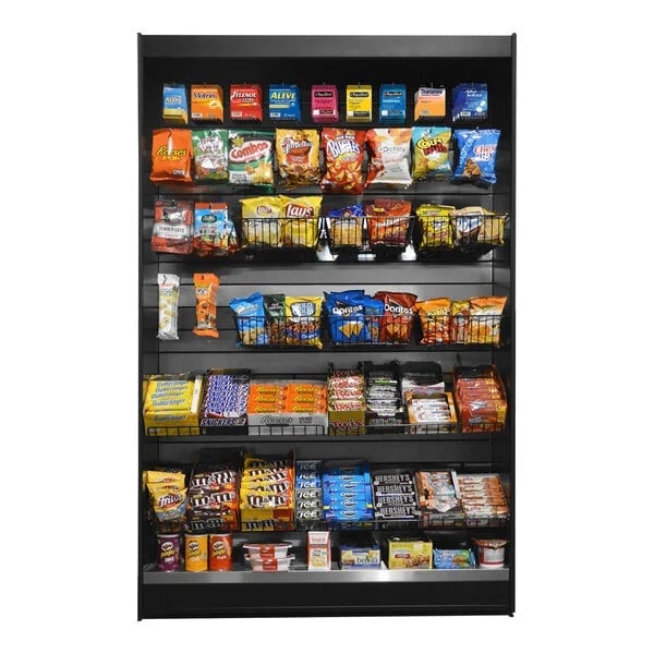 Vending machine display stocked with assorted snacks, candy, chips, and beverages organized on multiple shelves